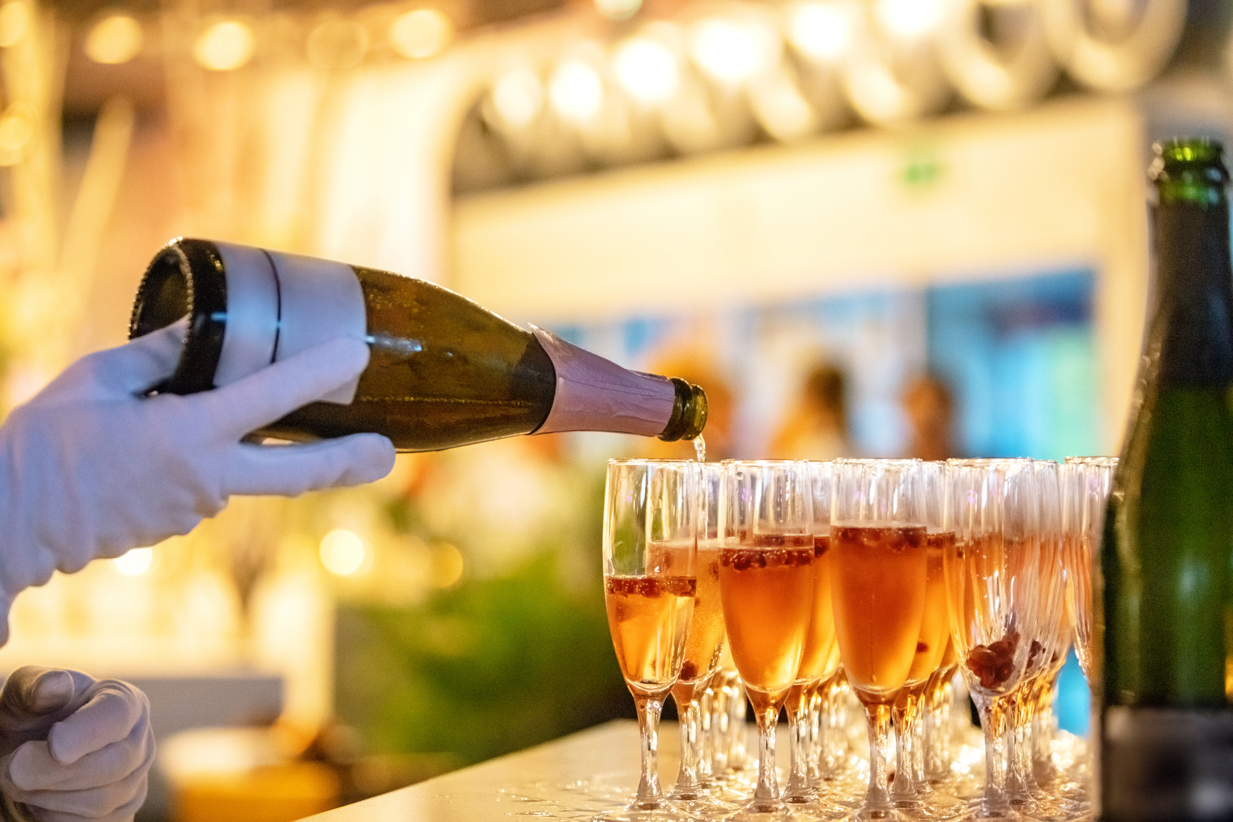 Waiter pouring champagne